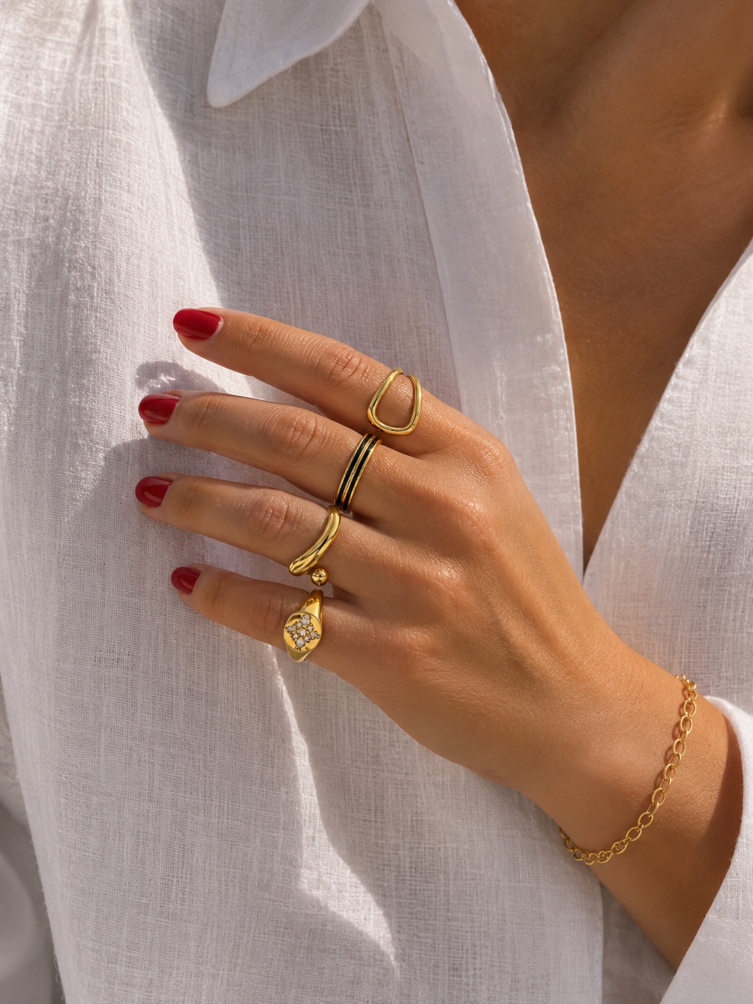 Stacked gold rings styled on the hand