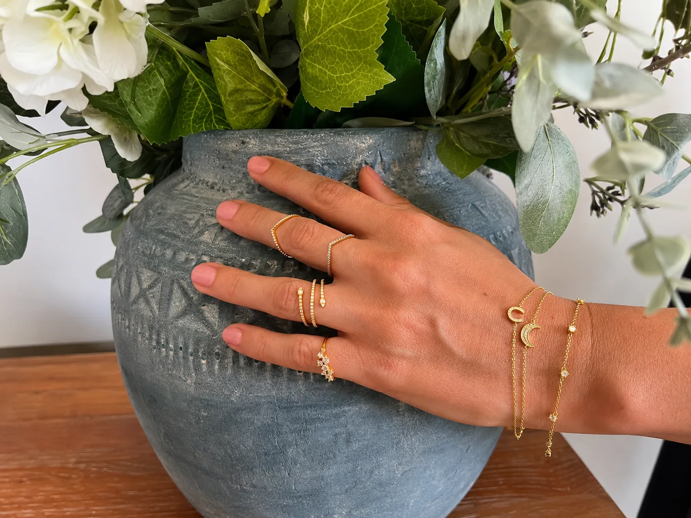 A flatlay of layered gold chains