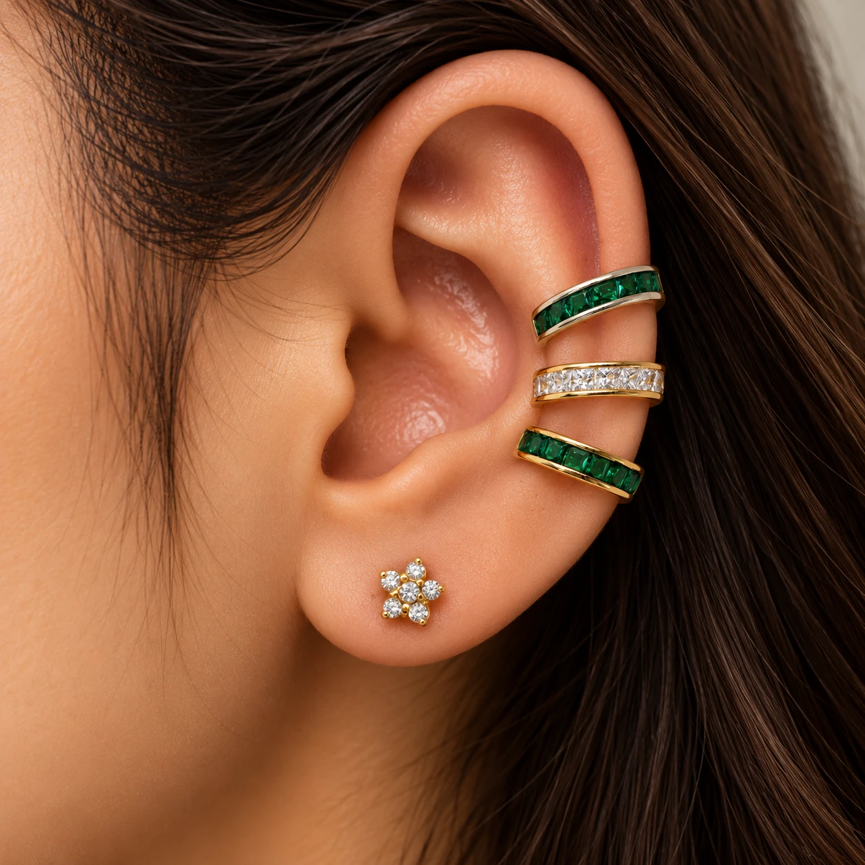 Emerald and crystal baguette ear cuffs in silver and gold with a crystal daisy stud
